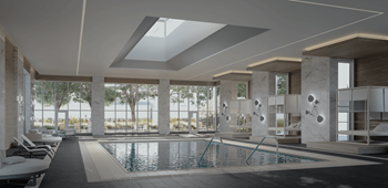A large indoor swimming pool with a skylight above it.